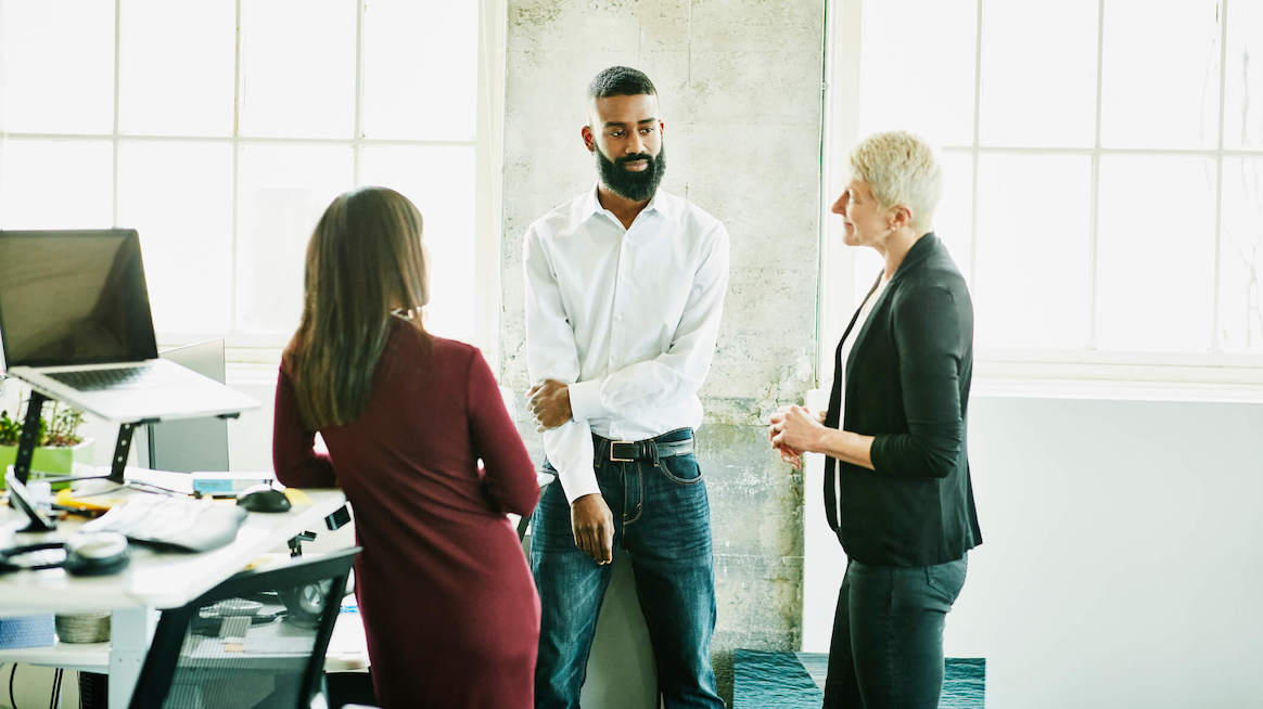 problem-statement-colleagues-gathered-talking-in-office