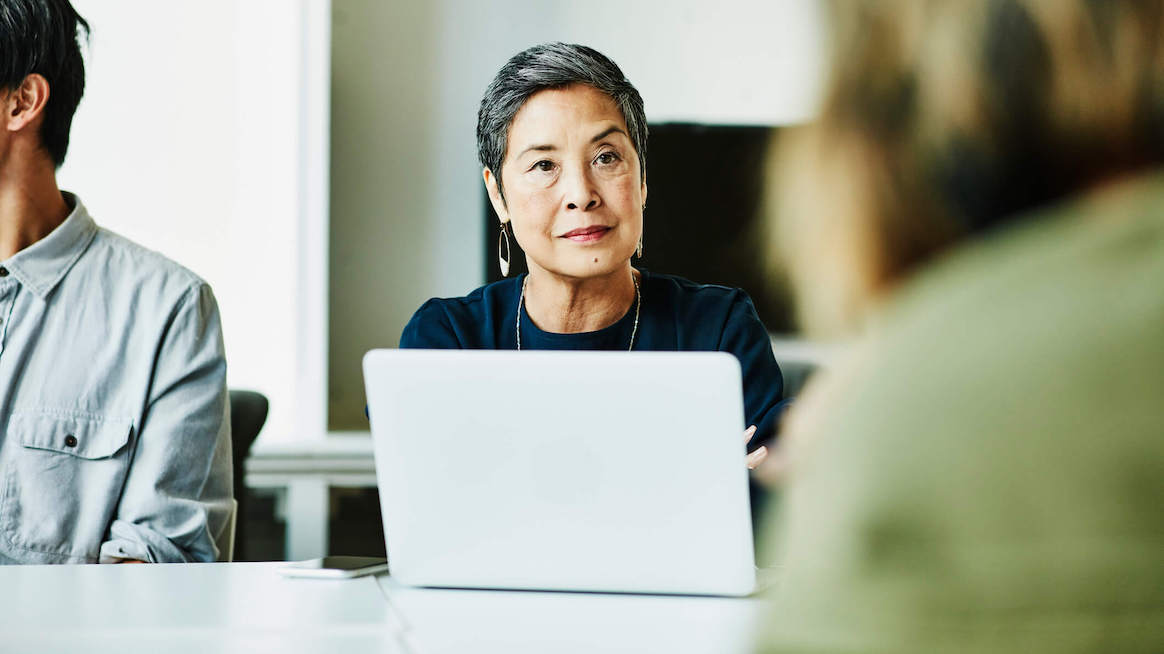 systems-thinking-woman-with-laptop-older