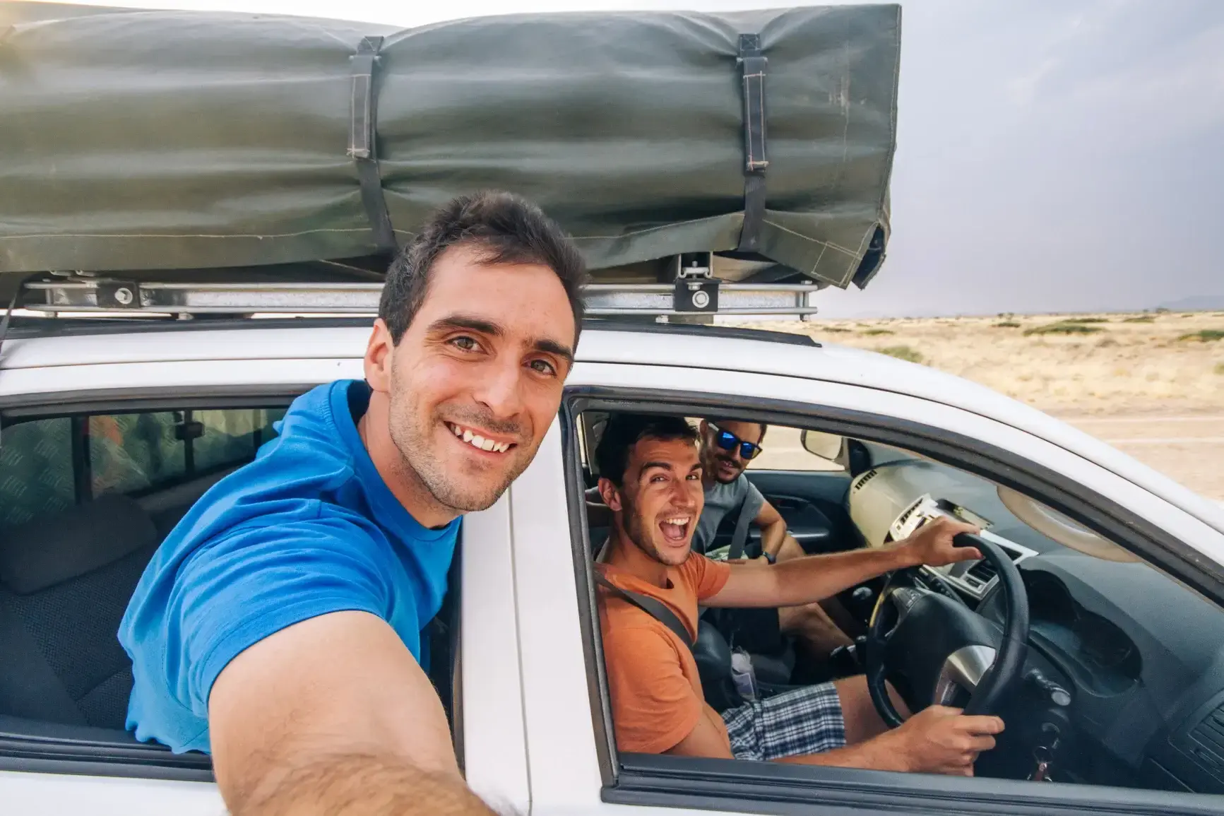 Selfie-Of-Friends-Traveling-In-Off-Road-Car 2