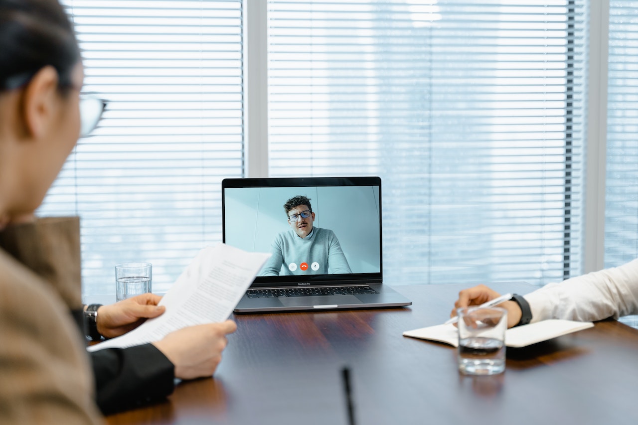 man-doing-video-conference-call-with-interview-coach-mock-interview